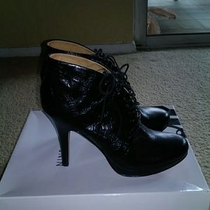 High heel, lace up, closed toe booties